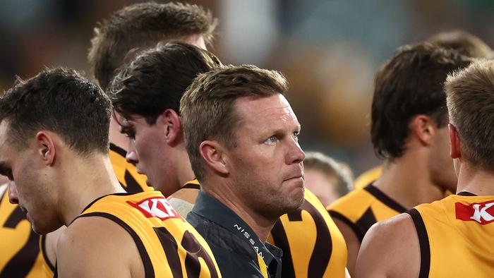 MELBOURNE, AUSTRALIA - APRIL 28: Sam Mitchell, Senior Coach of the Hawks talks to his players during the round seven AFL match between Hawthorn Hawks and Sydney Swans at Melbourne Cricket Ground, on April 28, 2024, in Melbourne, Australia. (Photo by Quinn Rooney/Getty Images)