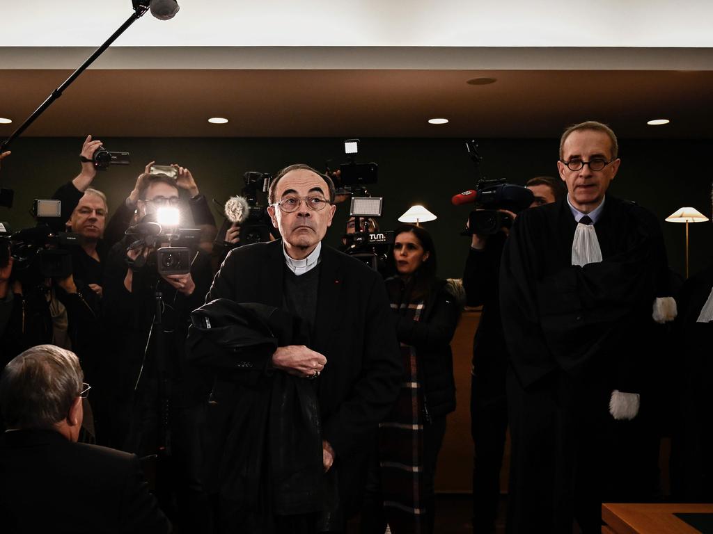 Lyon archbishop, cardinal Philippe Barbarin (C) arrives in Lyon court charged with failing to report a priest who abused boy scouts in the ‘80s and ‘90s. Picture: AFP