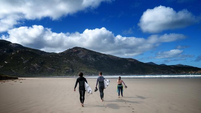 Surfers at Tidal River, Wilson’s Promontory. Picture: Tony Gough