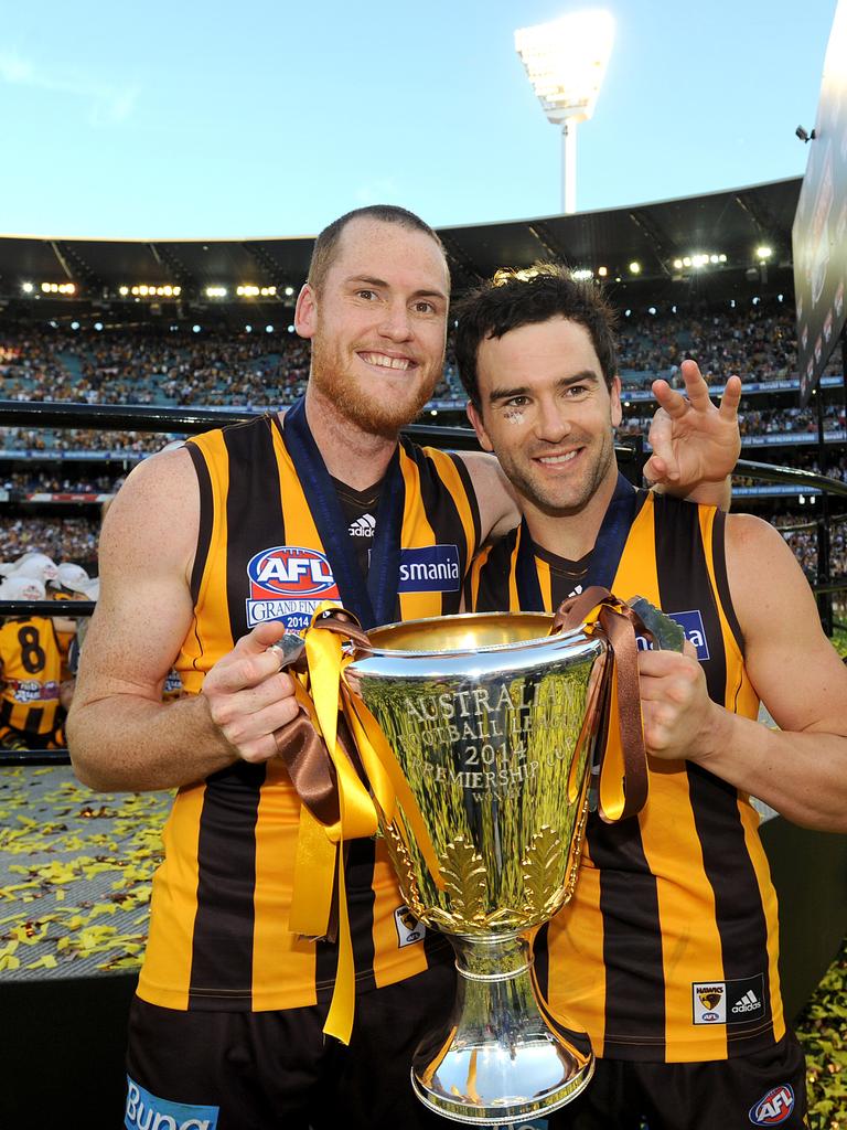 Jarryd Roughead and Jordan Lewis of Hawthorn celebrate winning the 2014 grand final.