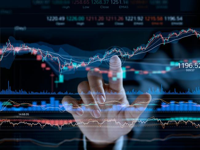 Businessman touching stock market graph on a virtual screen display.