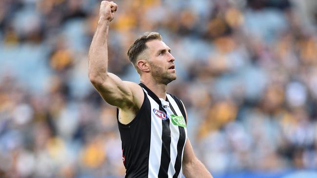 Travis Cloke celebrates kicking a goal against Hawthorn on Sunday.