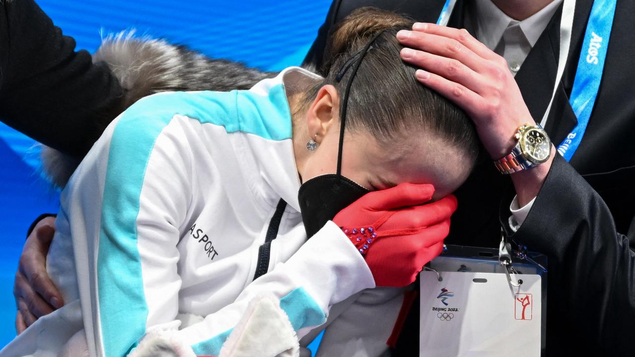 Russia's Kamila Valieva reacts after competing in the women's single skating free skating of the figure skating event during the Beijing 2022 Winter Olympic Games at the Capital Indoor Stadium in Beijing on February 17, 2022. (Photo by Manan VATSYAYANA / AFP)