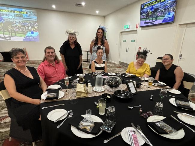 A group having fun at the Melbourne Cup event at the Carriers Arms Hotel.