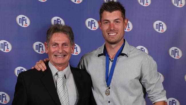 Matthew Dennis with his father, Allan, after winning his third Rosbrook Medal in 2017. Picture: Local Legends Photography.