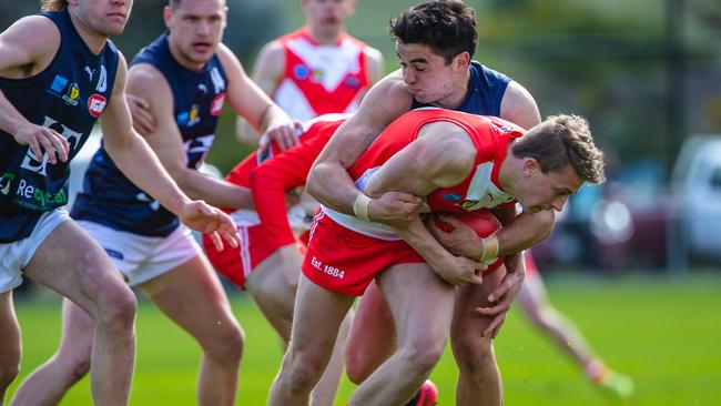 Launceston’s Miller Hodge wraps up Clarence’s Oscar Paprotny. Picture: SOLSTICE DIGITAL