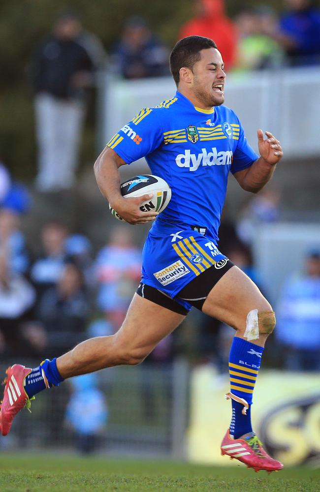 Jarryd Hayne races away to score against the Sharks.