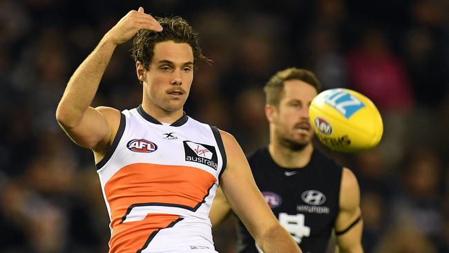 Josh Kelly of the Giants (left) is seen in action during the Round 12 AFL match between the Carlton Blues and the GWS Giants at Etihad Stadium in Melbourne, Sunday, June 11, 2017. (AAP Image/Julian Smith)