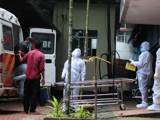 Health workers wearing protective take people who had been in contact with a person infected with the Nipah virus to an isolation centre in Kozikode, in India's Kerala state. Picture: AFP