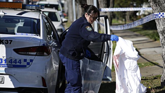 Police bagging evidence after Abounader was shot dead in August. Picture: Adam Yip