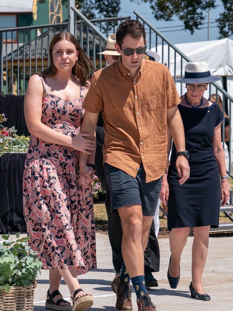 Bride and groom Mitchell Gaffney and Madeleine Edsell at a public memorial for those affected by the bus crash.