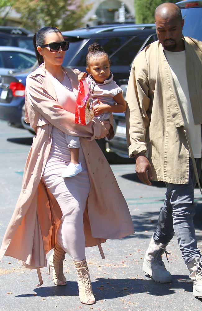 With little North and husband Kanye on July 12 in Los Angeles (27 degrees). Picture: Splash News Australia