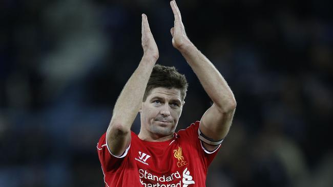 Liverpool's English midfielder Steven Gerrard applauds their supporters at the final whistle in the English Premier League football match between Leicester City and Liverpool at King Power Stadium in Leicester, central England on December 2, 2014. Liverpool won the game 3-1. AFP PHOTO/ADRIAN DENNIS RESTRICTED TO EDITORIAL USE. NO USE WITH UNAUTHORIZED AUDIO, VIDEO, DATA, FIXTURE LISTS, CLUB/LEAGUE LOGOS OR “LIVE” SERVICES. ONLINE IN-MATCH USE LIMITED TO 45 IMAGES, NO VIDEO EMULATION. NO USE IN BETTING, GAMES OR SINGLE CLUB/LEAGUE/PLAYER PUBLICATIONS.