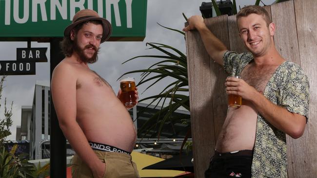 Joe Walker and Duncan Abraham working on their dad bod physiques before the big day. Picture: George Salpigtidis