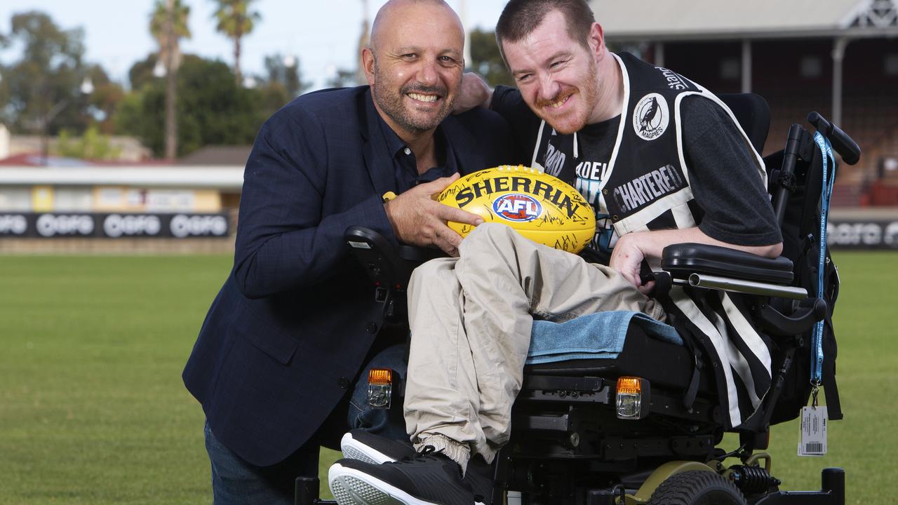 George Fiacchi with Port fan Chris McEvoy. Picture: Emma Brasier