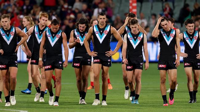 Port Adelaide players walk off Adelaide Oval after Thursday night’s loss. Picture: James Elsby/AFL Photos