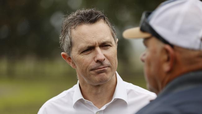 Jason Clare, speaking with Emanuel Degabriele as he visits a turf farm in Cornwallice outside Richmond. Picture: Tim Hunter.