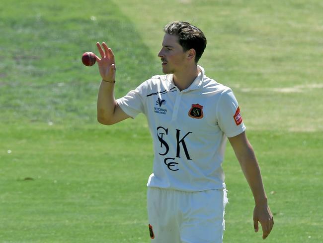 St Kilda’s Jon Merlo takes a bowling stint against Fitzroy Doncaster. Picture: Andy Brownbill