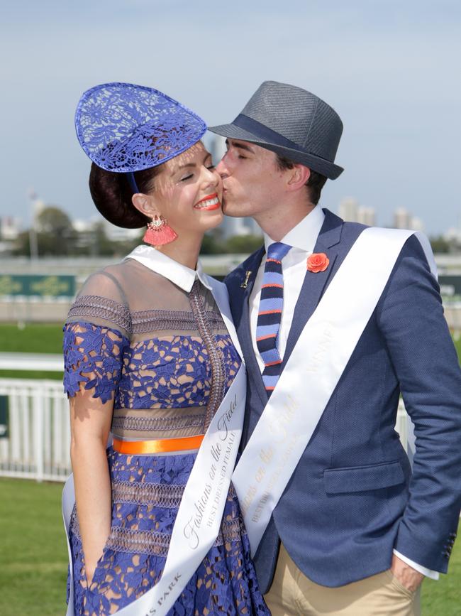 Fashions on The Field Best Dressed Couple, Brittany Baldwin and husband Mitchell Clough from Upper Coomera celebrate with a kiss. Pic Tim Marsden