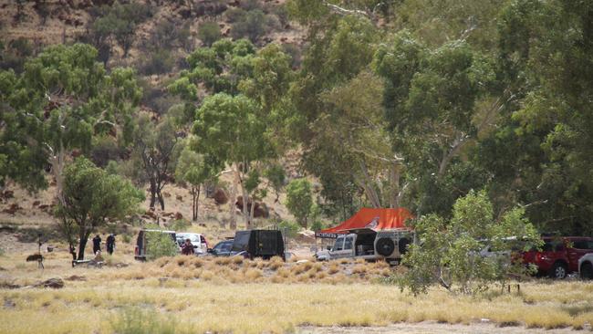 Northern Territory Police at the town camp north of Alice Springs on Sunday. Picture: Gera Kazakov