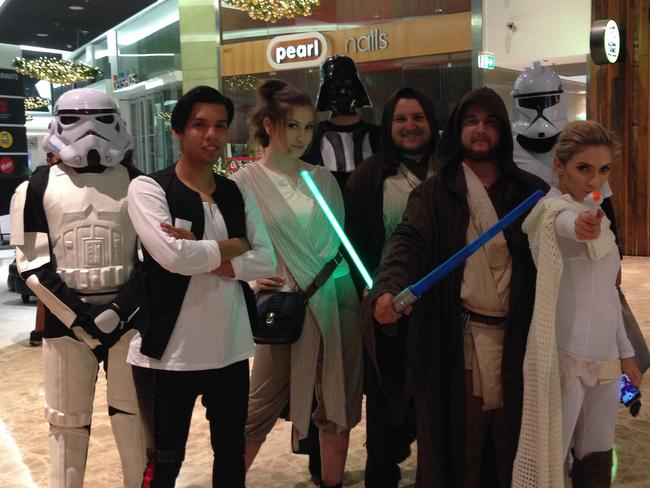 Cosplayers pose for a photograph ahead of the Midnight release of Star Wars: The Force Awakens at Event Cinemas in Parramatta, Sydney.