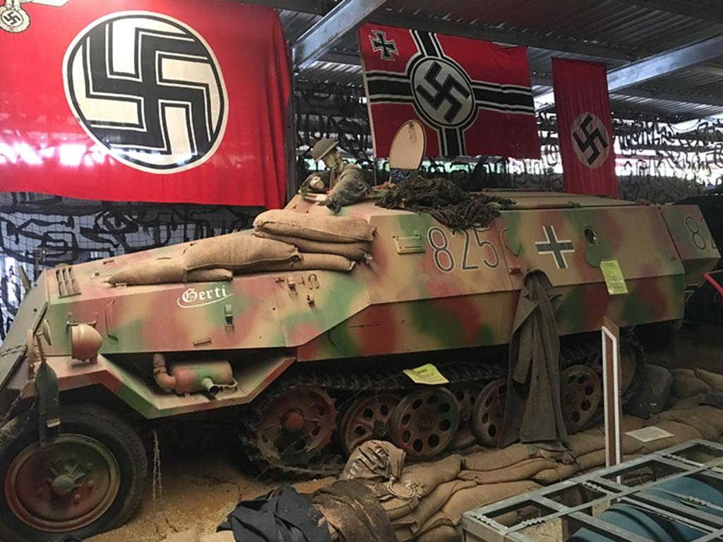 A German Half truck with Nazi flags.