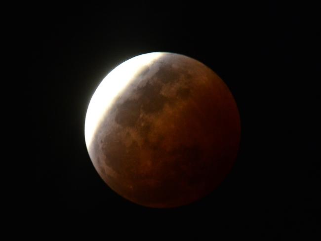 The lunar eclipse with a blood red moon seen in Queensland. Picture: Evan Morgan