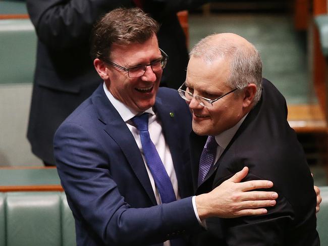 Alan Tudge hugs Treasurer Scott Morrison after delivering the 2017 Budget in the House of Representatives Chamber, in Parliament House, Canberra. Picture Kym Smith