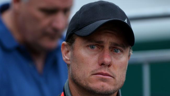 Australia’s Lleyton Hewitt watches Australia’s Bernard Tomic lose against France’s Lucas Pouille.