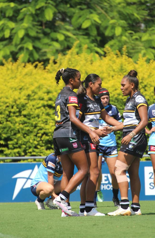 Phoenix Raine-Hippi, Mercedez Taulelei-Siala and Savannah Roberts-Hickling celebrate a try last season.