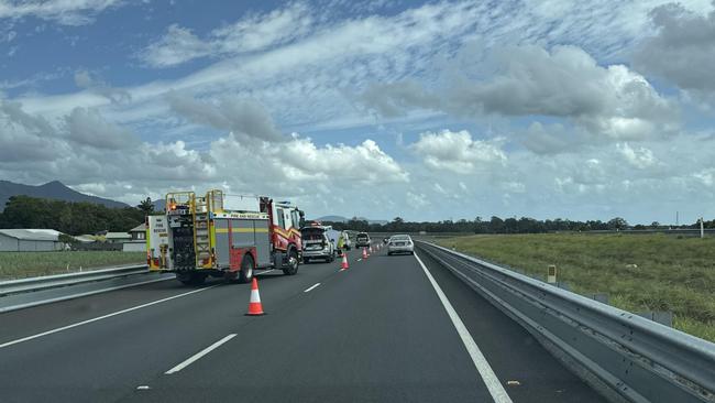 Emergency services at the scene of a bike and vehicle incident on the Bruce Hwy at Wrights Creek.