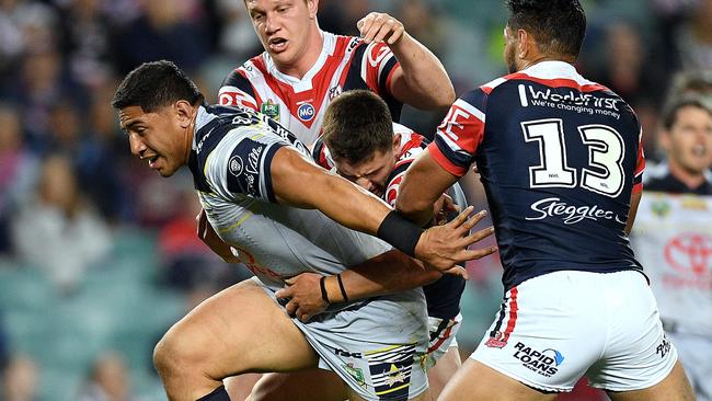 Jason Taumalolo of the Cowboys is tackled by Dylan Napa, Victor Radley and Issac Liu.