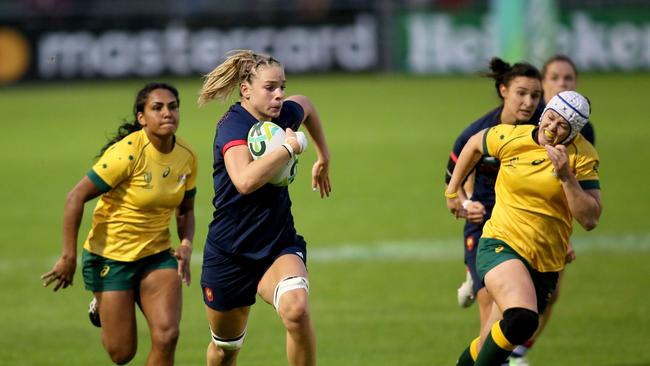 France's flanker Romane Menager runs in another try against the Wallaroos.