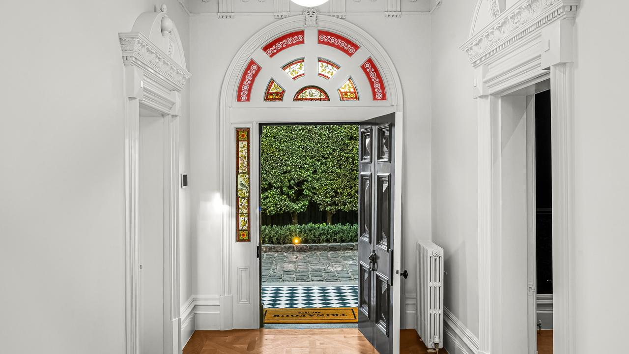 Original arches, fireplaces, rosettes and staircases have been meticulously restored.
