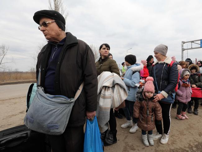 People fleeing the conflict in Ukraine cross the Moldova-Ukraine border checkpoint near the town of Palanca. Picture: AFP.