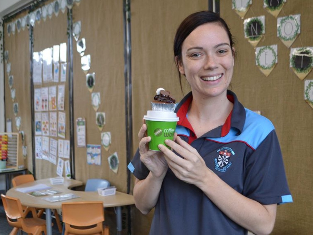 Blackfriars Priory School reception teacher Kendall Schenk with a cupcake and coffee given to all staff by the school's Parents and Friends committee to thank them for their hard work. Picture: Supplied