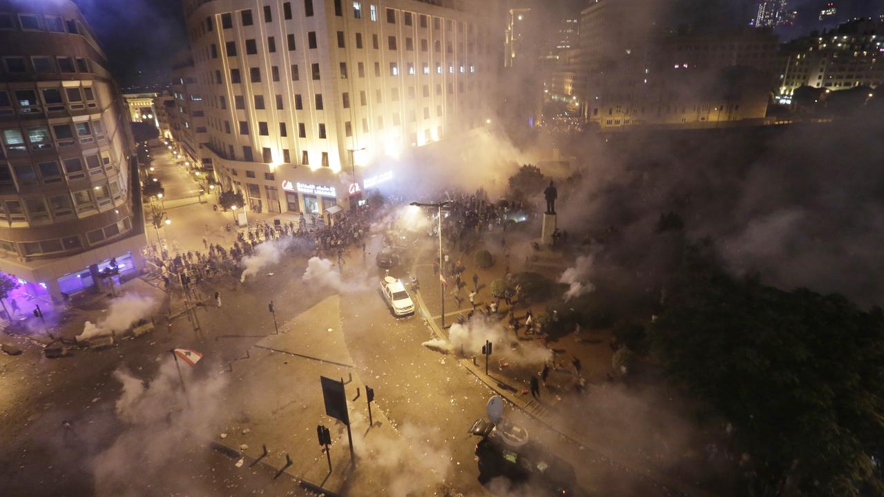 Lebanese riot police fire tear gas during a protest against government's plans to impose new taxes in Beirut, Lebanon,. Photo: Hassan Ammar/AP