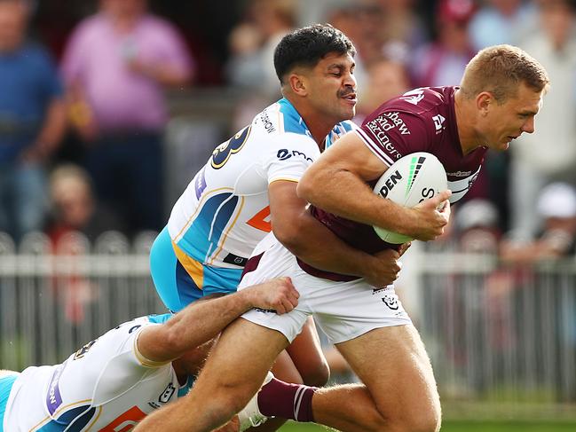 MUDGEE, AUSTRALIA - APRIL 17: Tom Trbojevic of the Sea Eagles is tackled during the round six NRL match between the Manly Sea Eagles and the Gold Coast Titans at Glen Willow Sporting Complex, on April 17, 2021, in Mudgee, Australia. (Photo by Mark Metcalfe/Getty Images)