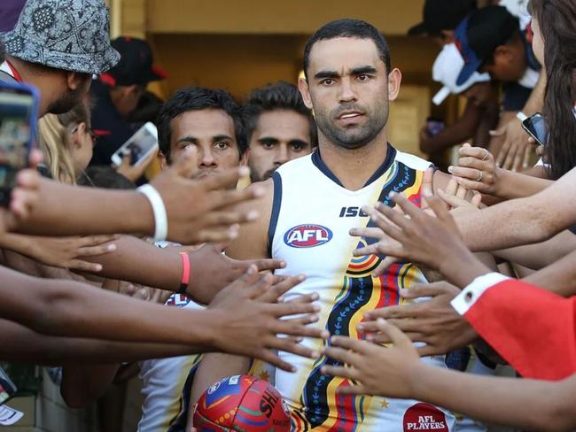 Shaun Burgoyne leads the Indigenous All Stars out onto the ground in 2015. Picture: AFL Photos