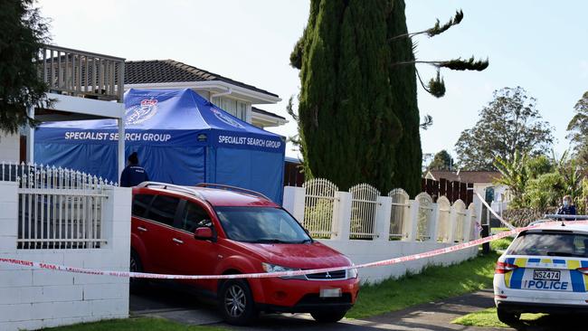 Police at the scene after the children’s remains were found. Picture: Jed Bradley/NZ Herald