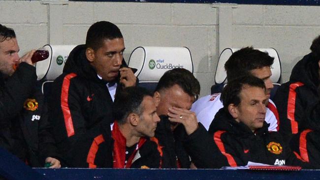 Manchester United's Dutch manager Louis van Gaal (C) reacts during the English Premier League football match between West Bromwich Albion and Manchester United at The Hawthorns in West Bromwich, central England on October 20, 2014. AFP PHOTO / PAUL ELLIS RESTRICTED TO EDITORIAL USE. No use with unauthorized audio, video, data, fixture lists, club/league logos or “live” services. Online in-match use limited to 45 images, no video emulation. No use in betting, games or single club/league/player publications.