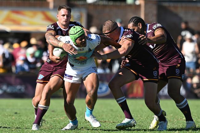 Cooper Bai of the Titans is tackled during the 2025 NRL Pre-Season Challenge match between Brisbane Broncos and Gold Coast Titans. Photo by Bradley Kanaris/Getty Images.