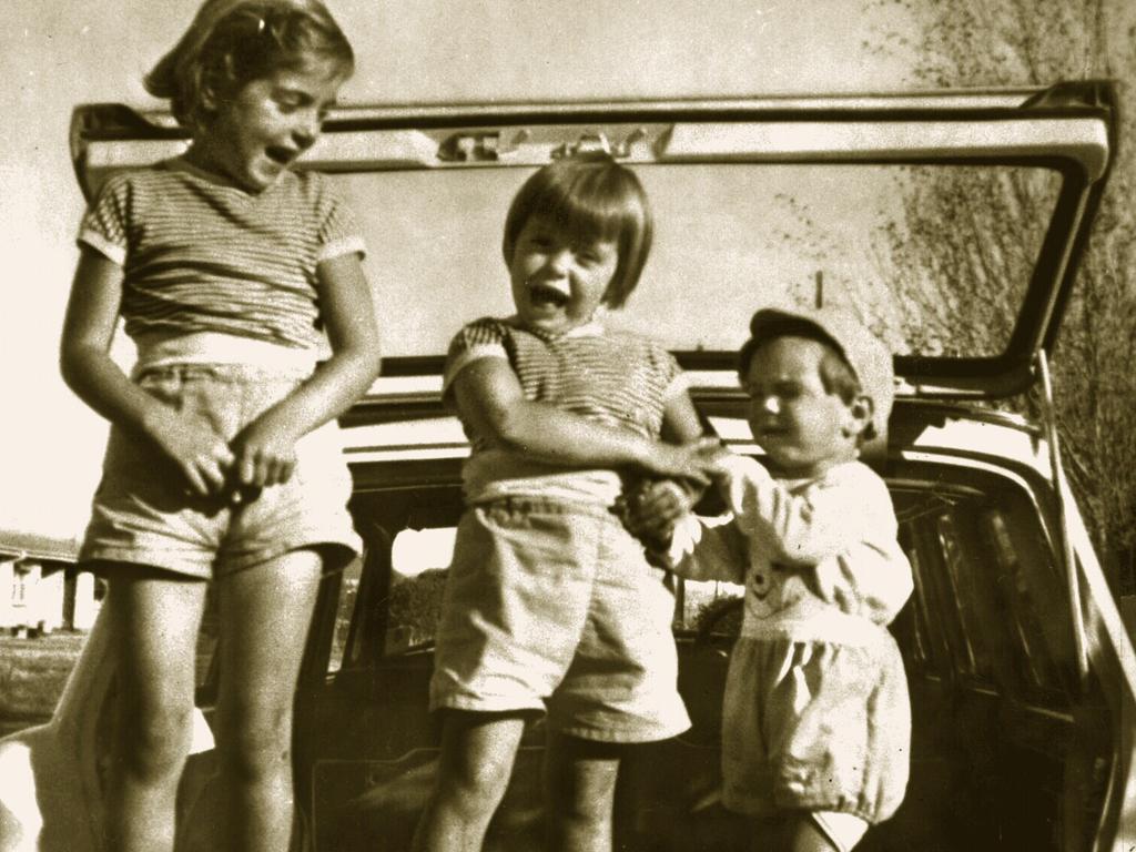 <p>Jane, Arnna and Grant in the back of a car during a family outing.</p>