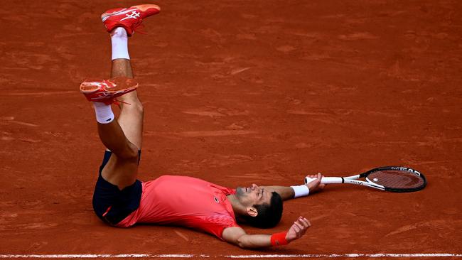 Novak Djokovic of Serbia celebrates winning match point against.