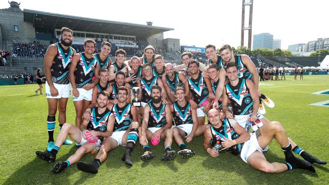 Power players celebrate their win this year in Shanghai. Picture: Michael Willson/AFL Photos