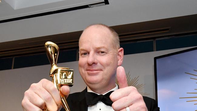 Tom Gleeson poses for a photograph after winning the Gold Logie for most popular personality on Australian TV. Picture: AAP Image/Darren England