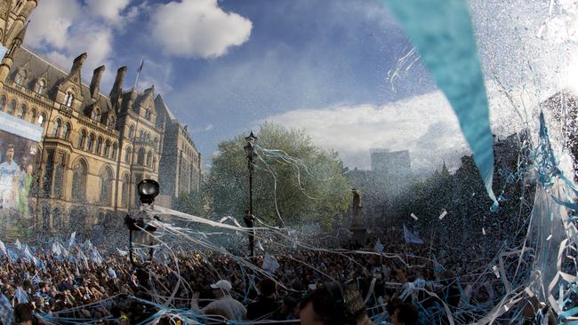 Manchester's Albert Square is swathed in confetti.