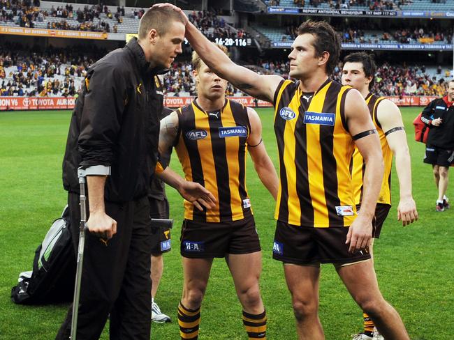 Luke Hodge consoles Max Bailey in an extremely injury interrupted Hawthorn season.