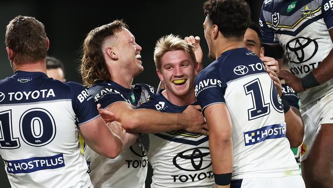 Tom Dearden celebrates with team mates after scoring a try. Picture: Getty Images