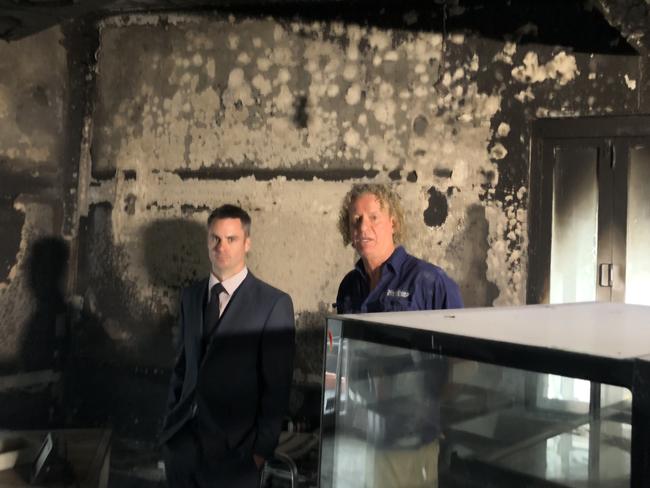 Yarra Ranges detective Senior Constable Michael Potter and owner Martin Shaw at the burnt down cafe.